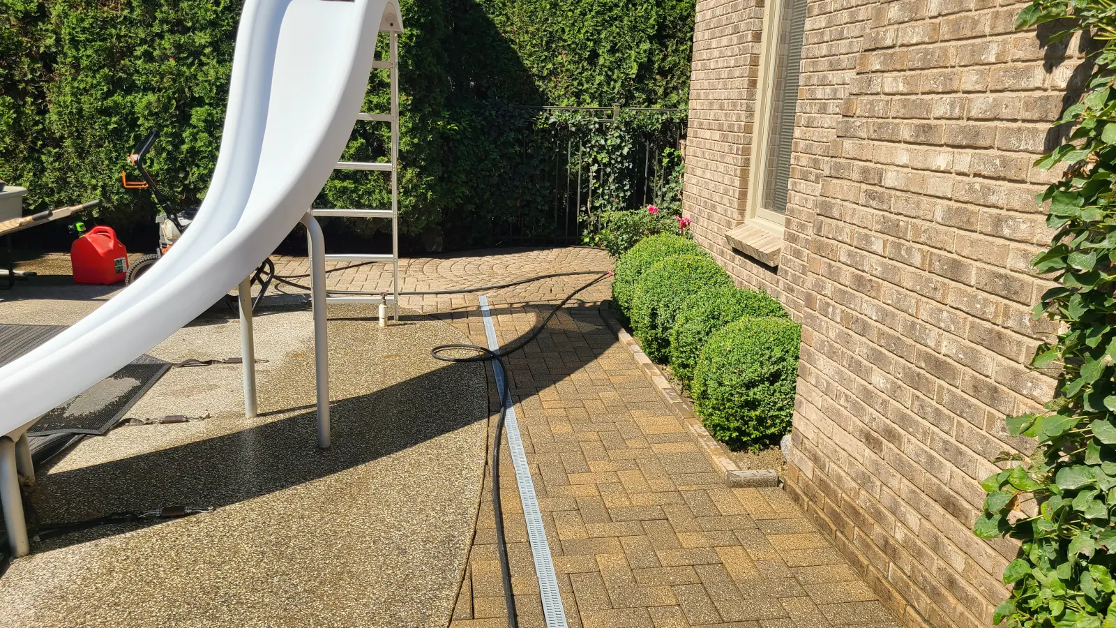 Custom paver patio with landscaping in Clinton Township